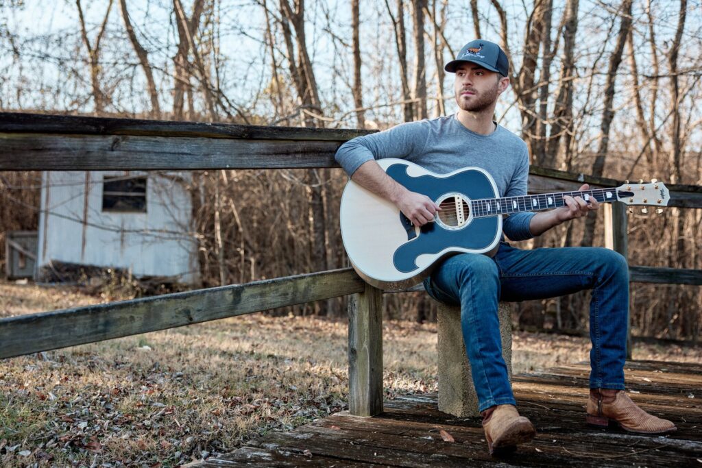 Video thumbnail image of Taylor country artist Greylan James playing a Taylor acoustic guitar