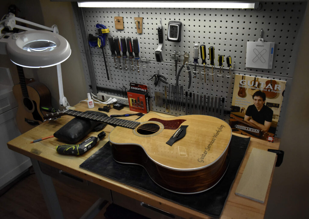 Image showing a guitar technician's workbench with guitar maintenance tools