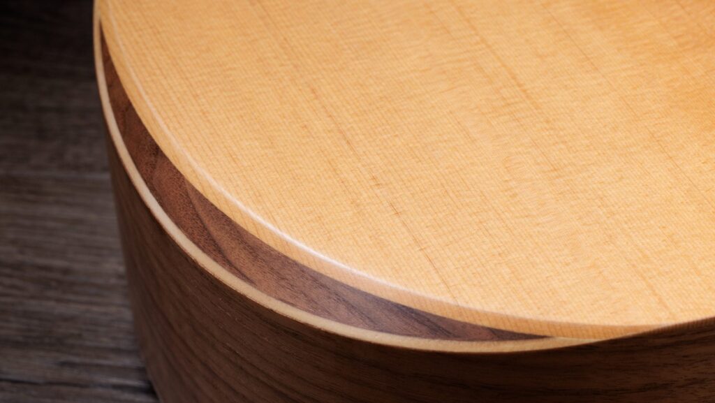 Close-up image of the armrest featured in Taylor's Academy Series acoustic guitars