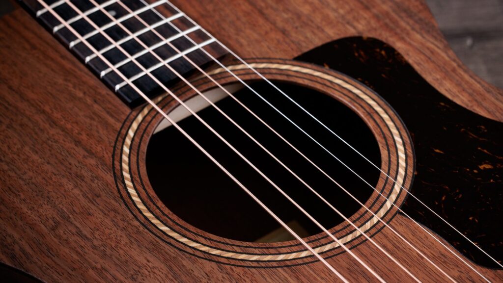 Close-up image of a Taylor Academy 22e acoustic guitar, a great gift for guitar players